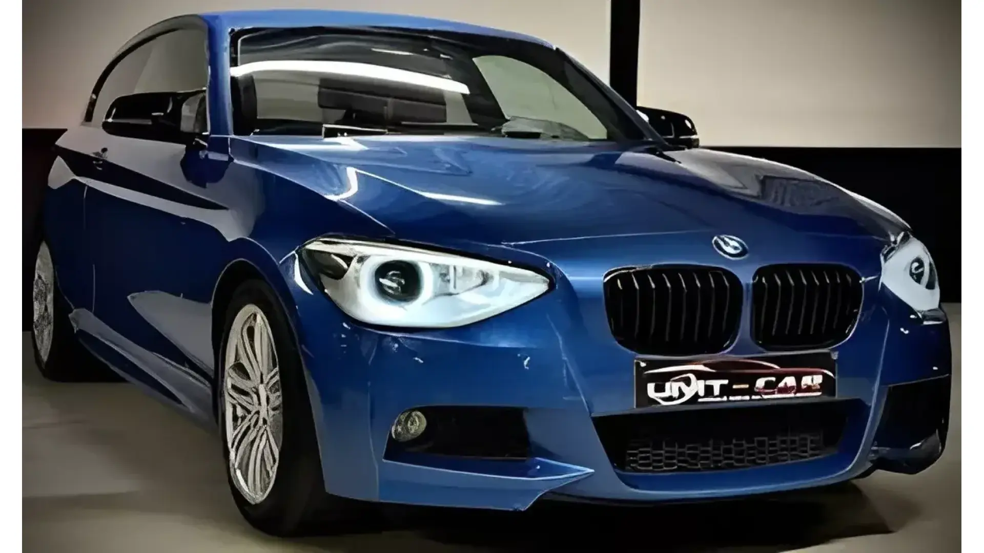 BMW 118i Benzine – Luxe & Comfort met Opendak en Navi! - Afbeelding 1 (groot)