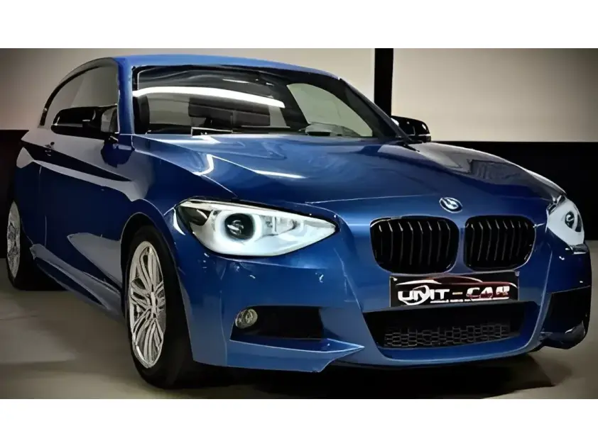 BMW 118i Benzine – Luxe & Comfort met Opendak en Navi! - Afbeelding 1